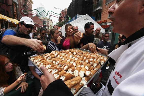 Figure 25: World famous Cannoli-eating competition at the San Gennaro Feast